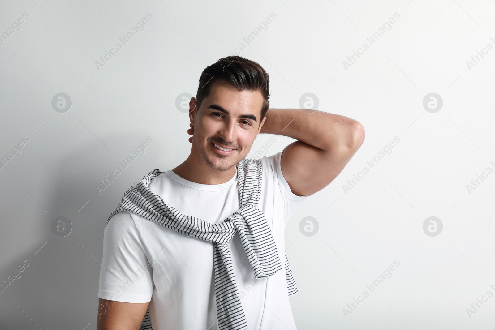 Photo of Portrait of handsome young man on white background