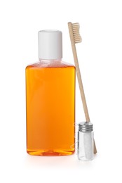 Photo of Mouthwash, toothbrush and dental floss isolated on white