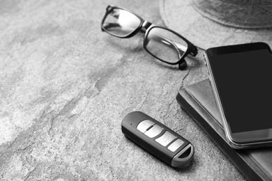 Photo of Composition with male accessories and remote car key on grey background. Space for text