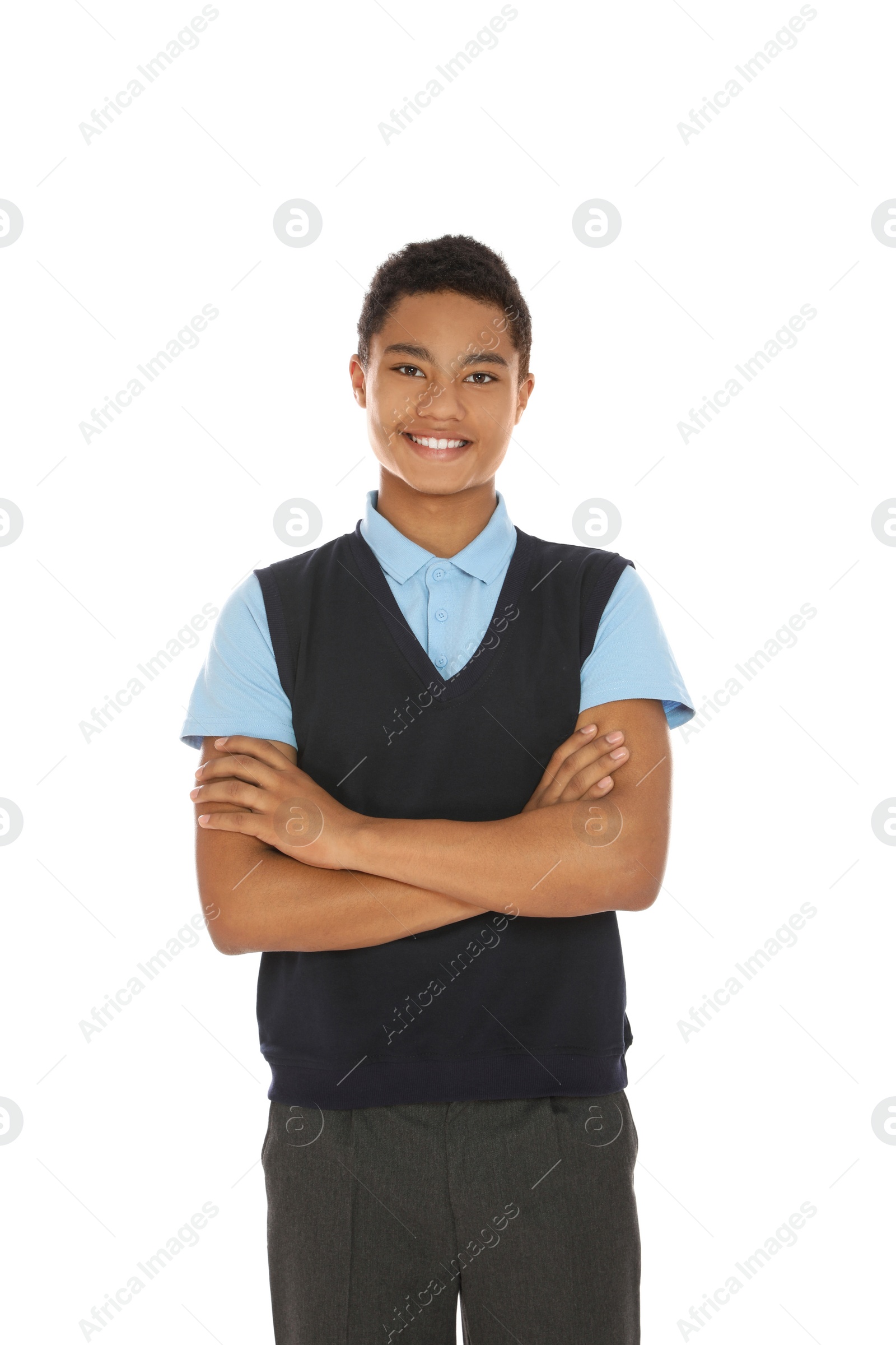 Photo of Portrait of African-American boy in school uniform on white background