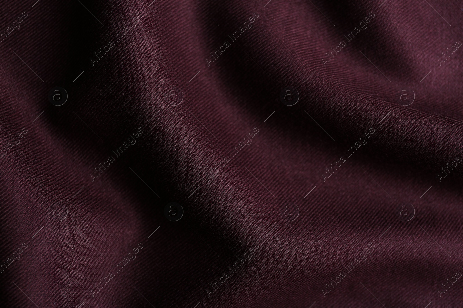 Photo of Texture of beautiful dark red fabric as background, closeup