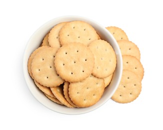 Tasty crackers in bowl isolated on white, top view