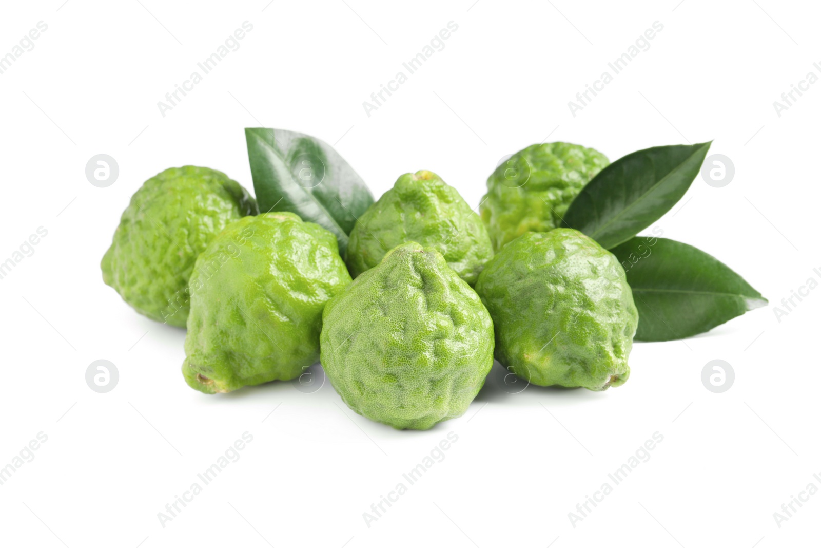 Photo of Fresh ripe bergamot fruits and leaves on white background