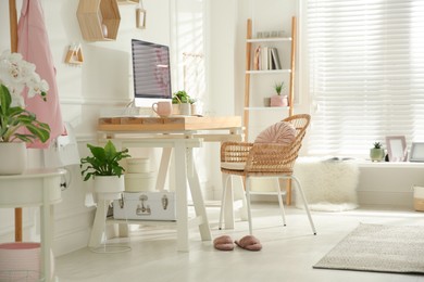 Photo of Stylish home office interior with comfortable workplace