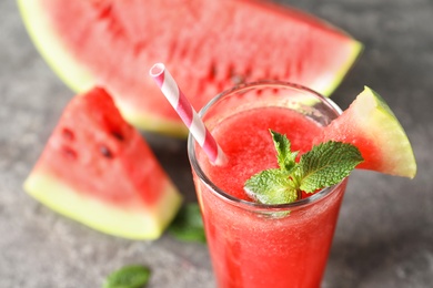 Tasty summer watermelon drink in glass on table, closeup