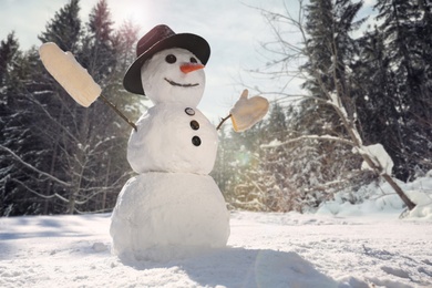 Image of Funny snowman outdoors on sunny day, space for text