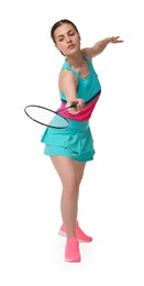 Young woman playing badminton with racket on white background