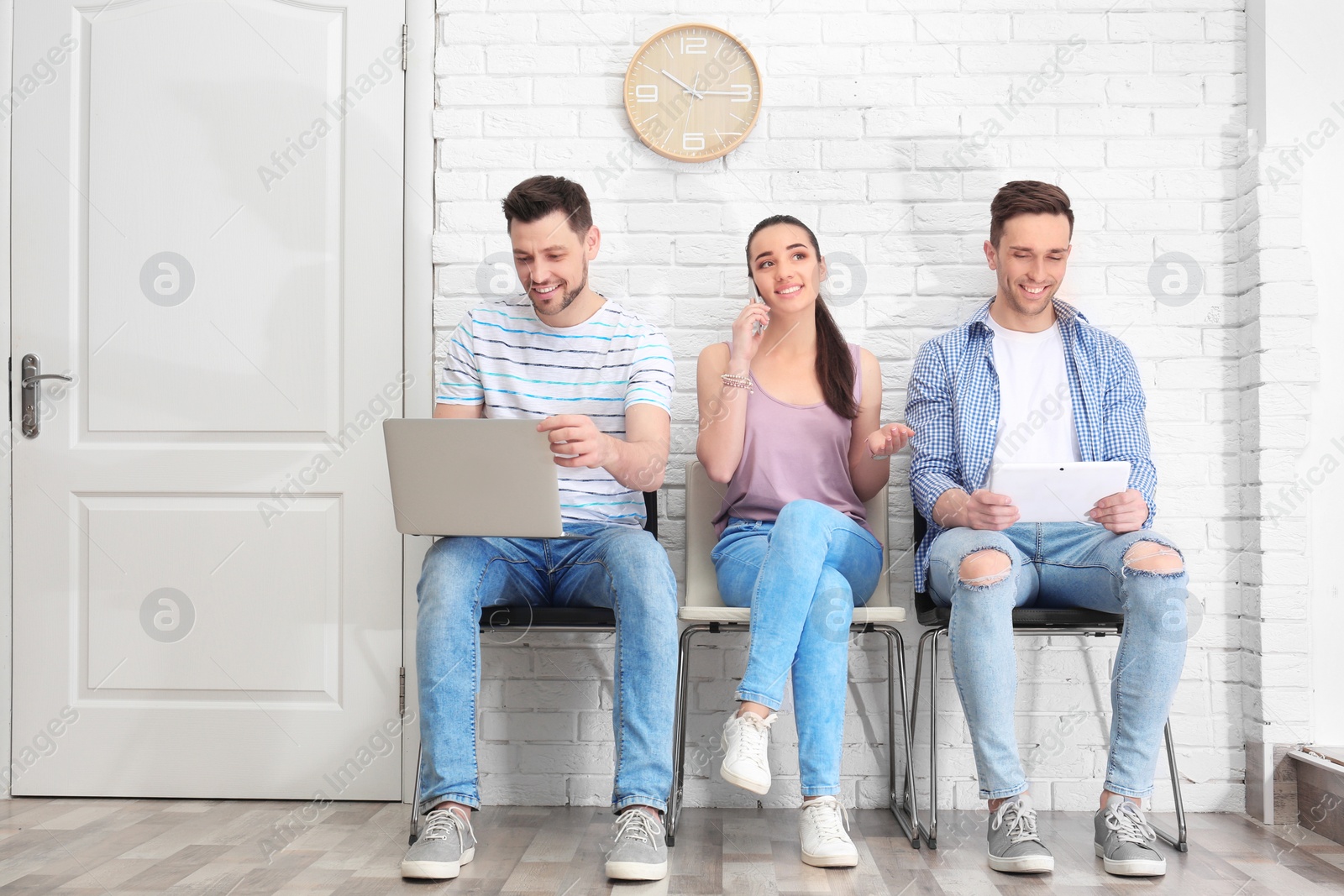 Photo of Group of people waiting for job interview, indoors