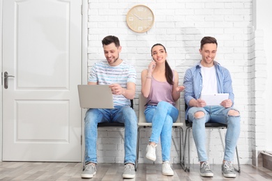 Group of people waiting for job interview, indoors