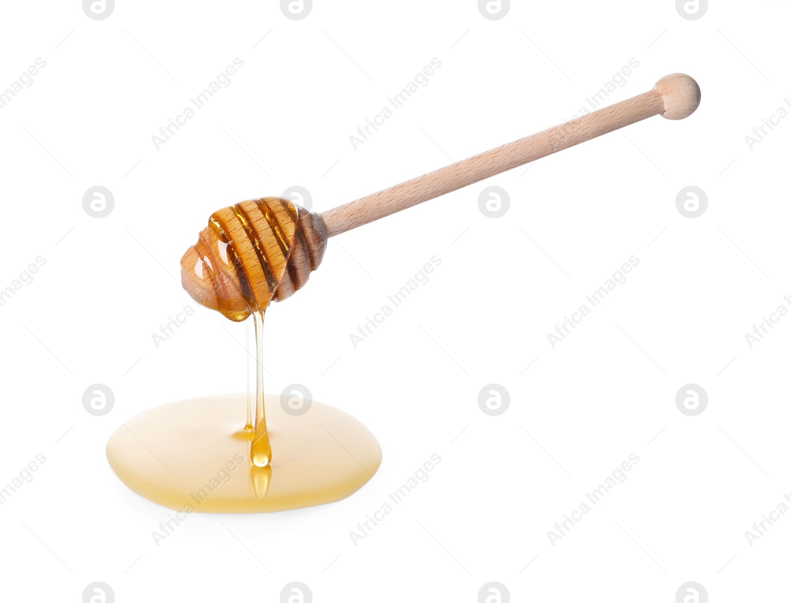 Photo of Fresh honey dripping from dipper on white background