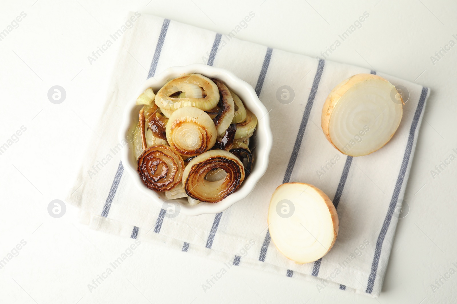 Photo of Tasty fried onion on white table, flat lay