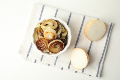 Tasty fried onion on white table, flat lay