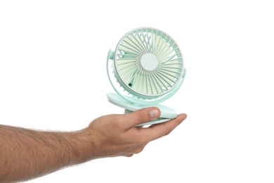 Man with portable fan on white background, closeup. Summer heat