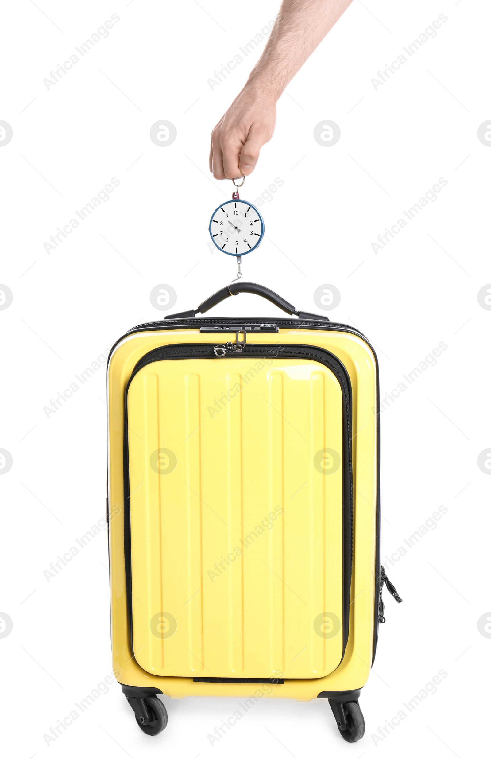 Photo of Man weighing stylish suitcase on white background