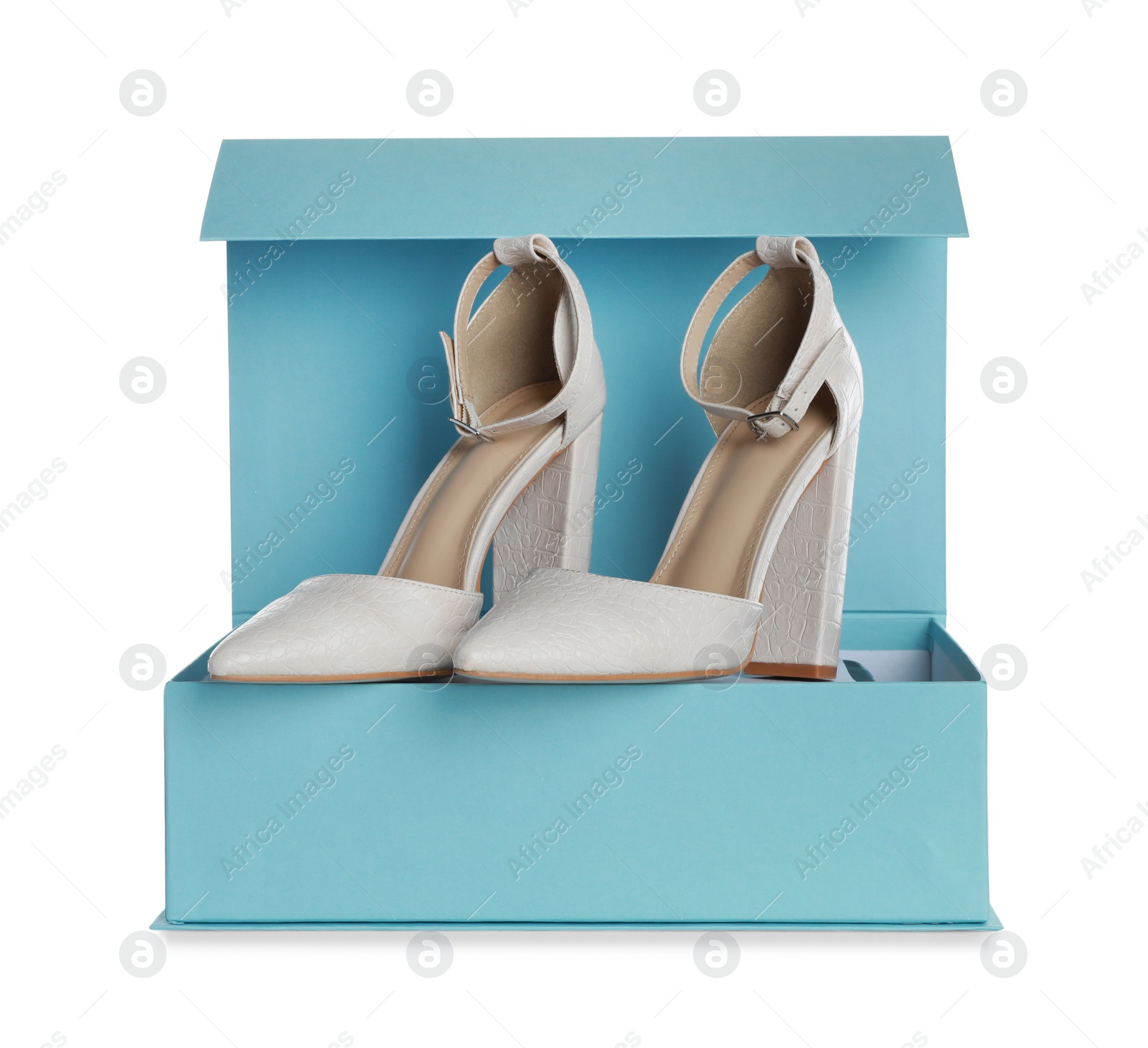 Photo of Pair of stylish shoes and turquoise box on white background