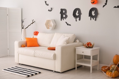Photo of Stylish room interior with creative Halloween decor