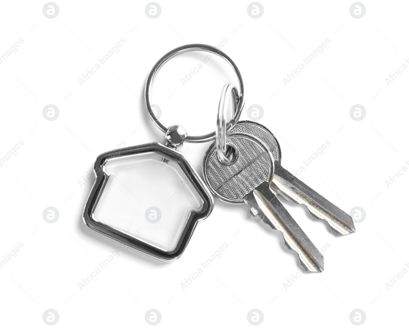 Photo of House keys with trinket on white background, top view