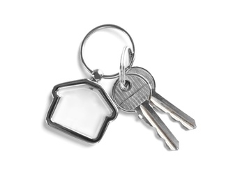 Photo of House keys with trinket on white background, top view