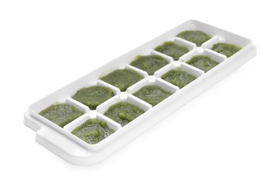 Photo of Broccoli puree in ice cube tray isolated on white. Ready for freezing