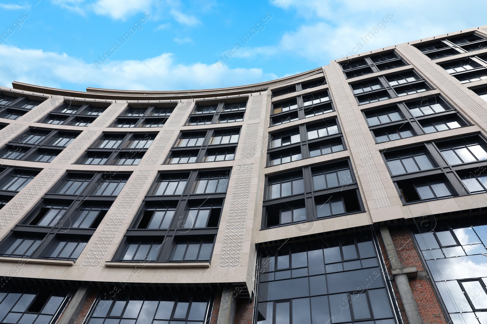 Photo of Low angle view of modern building on city street