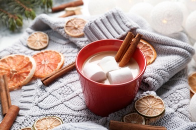 Photo of Composition with hot cocoa drink on table