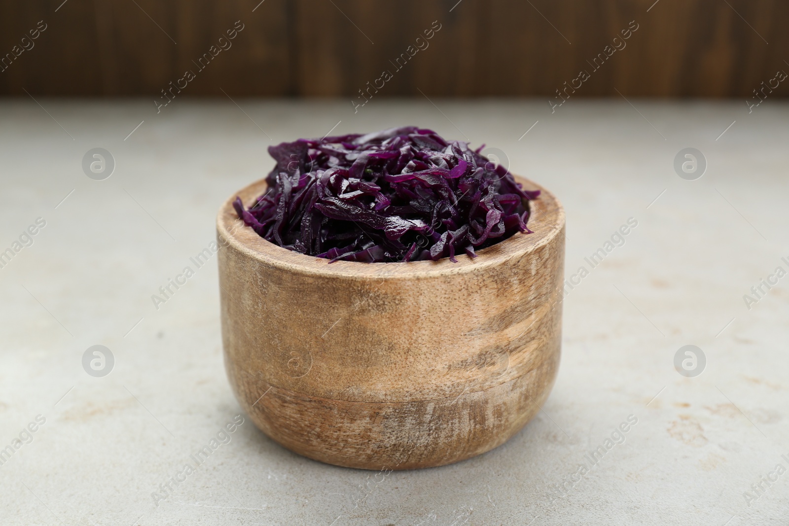 Photo of Tasty red cabbage sauerkraut on beige table