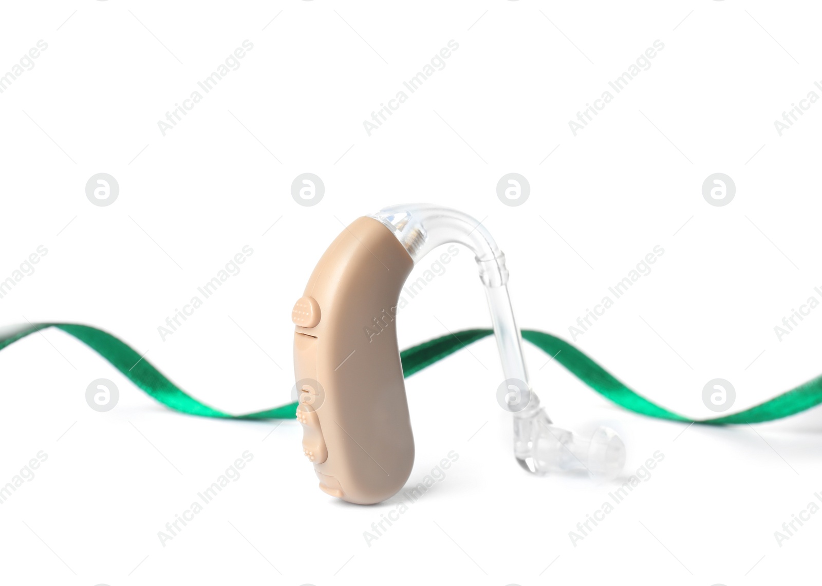 Photo of Hearing aid and ribbon on white background