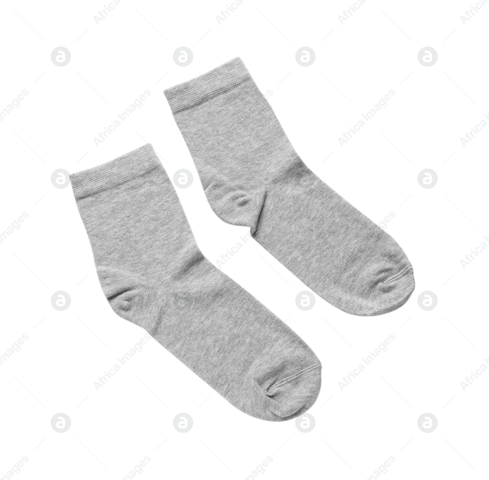 Photo of Pair of grey socks isolated on white, top view