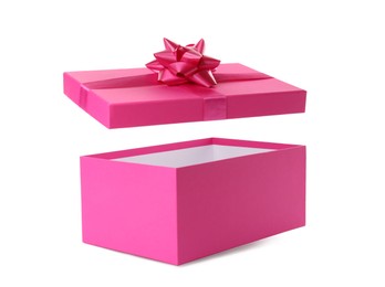 Photo of Pink gift box and lid with bow on white background