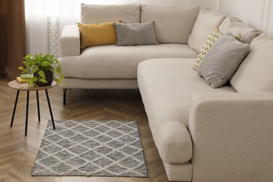 Photo of Modern living room interior with comfortable sofa and rug