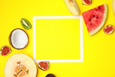 Photo of Flat lay composition with melon, other fruits and space for text on color background