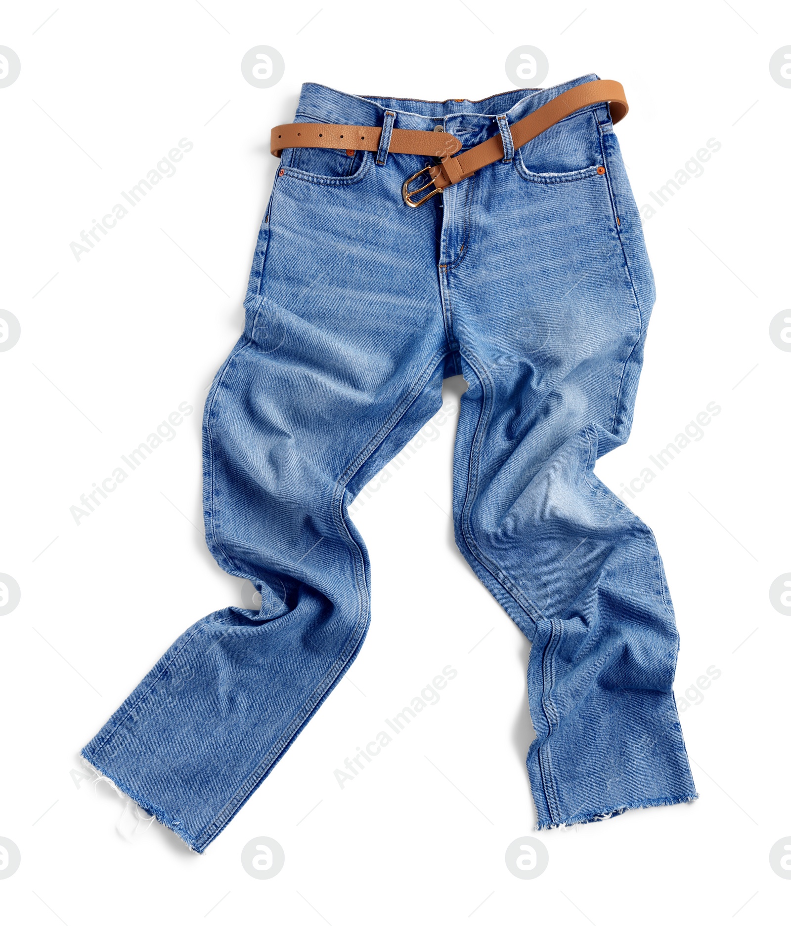 Photo of Rumpled light blue jeans with belt isolated on white, top view. Stylish clothes