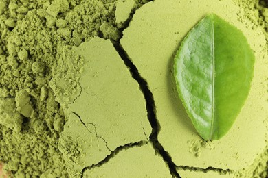 Photo of Green matcha powder and leaf as background, top view