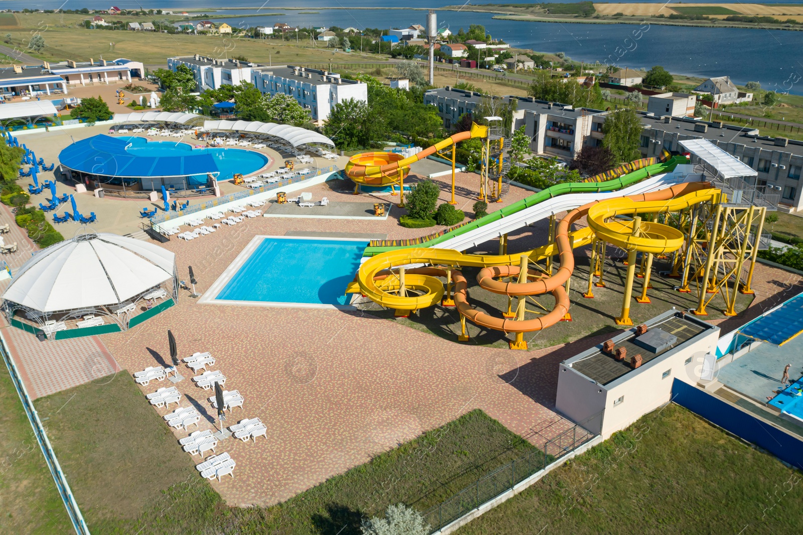 Image of Aerial view of water park on sunny day