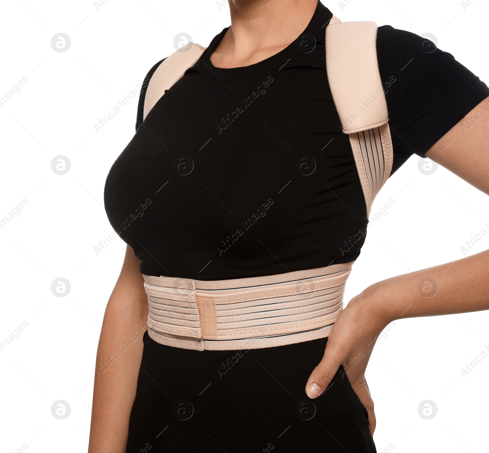 Photo of Closeup view of woman with orthopedic corset on white background