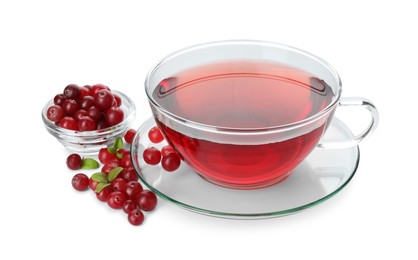 Photo of Cup of delicious cranberry tea and berries isolated on white