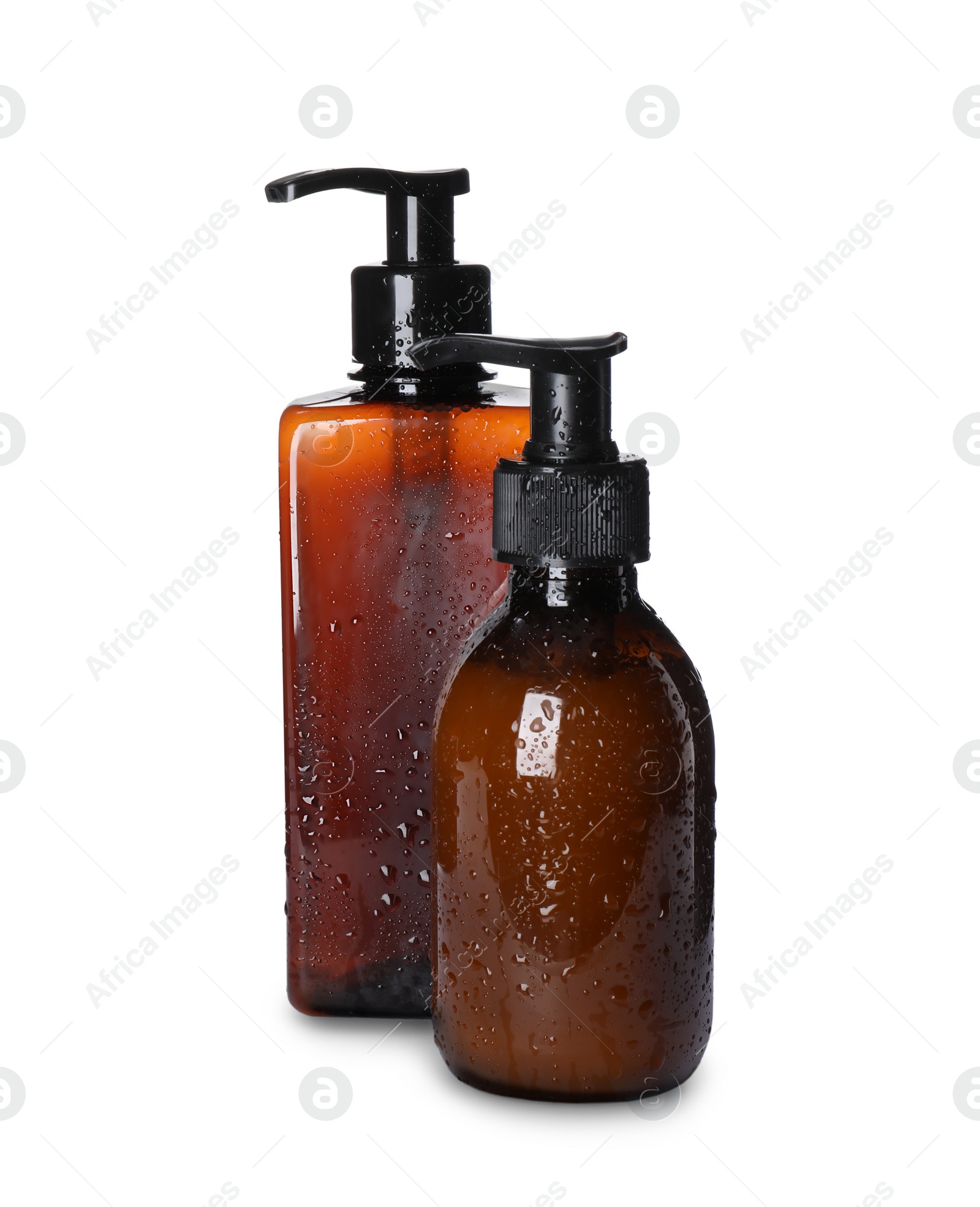 Photo of Dispenser bottles with water drops isolated on white. Men's cosmetics