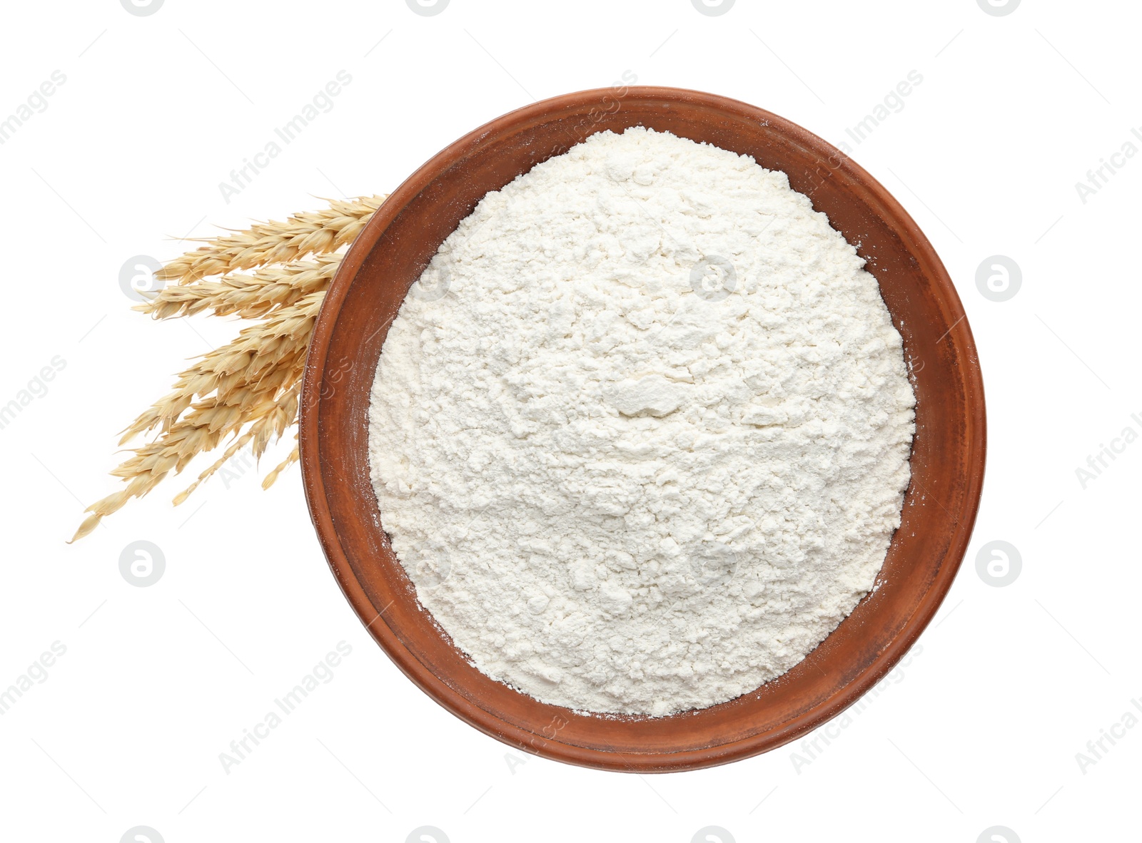 Photo of Organic flour and spikelets isolated on white, top view