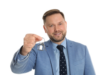 Photo of Real estate agent holding key on white background