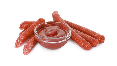 Thin dry smoked sausages served with ketchup isolated on white