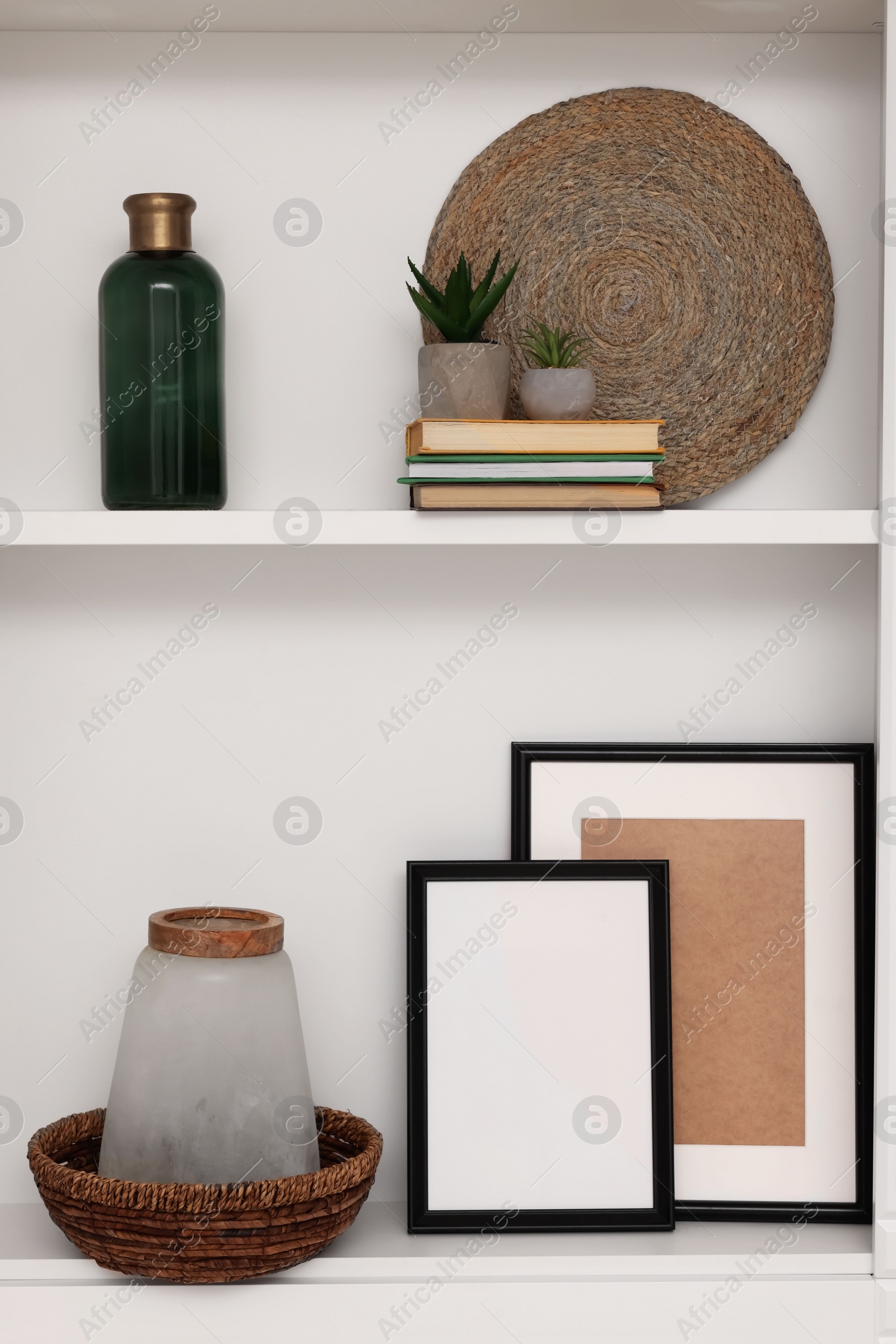 Photo of Shelves with different decor indoors. Interior design