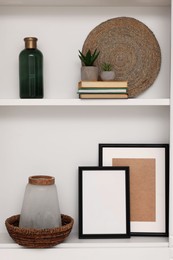 Shelves with different decor indoors. Interior design