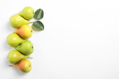 Photo of Ripe juicy pears on white background, top view