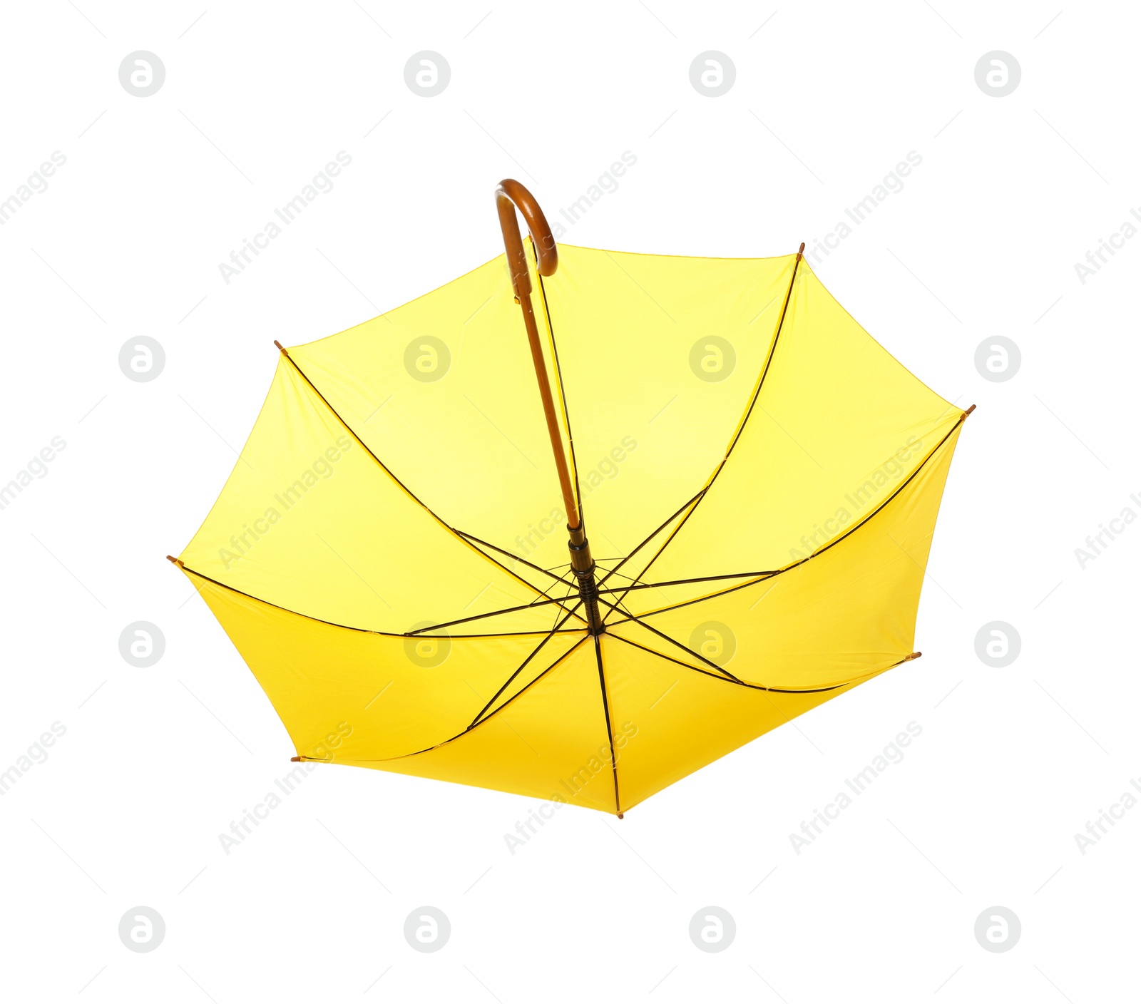 Photo of Modern opened yellow umbrella isolated on white