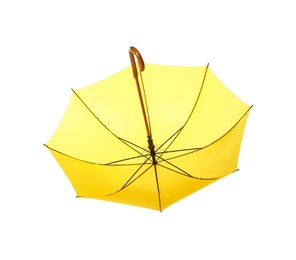 Photo of Modern opened yellow umbrella isolated on white