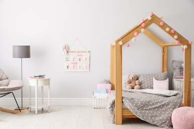 Stylish child room interior with comfortable bed