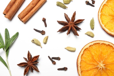 Photo of Different mulled wine ingredients on white background, flat lay