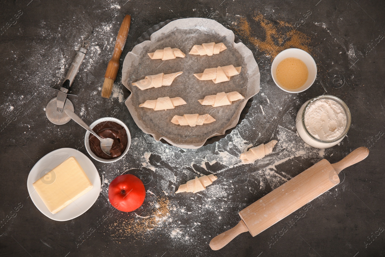 Photo of Flat lay composition with ingredients and raw croissants on grey background