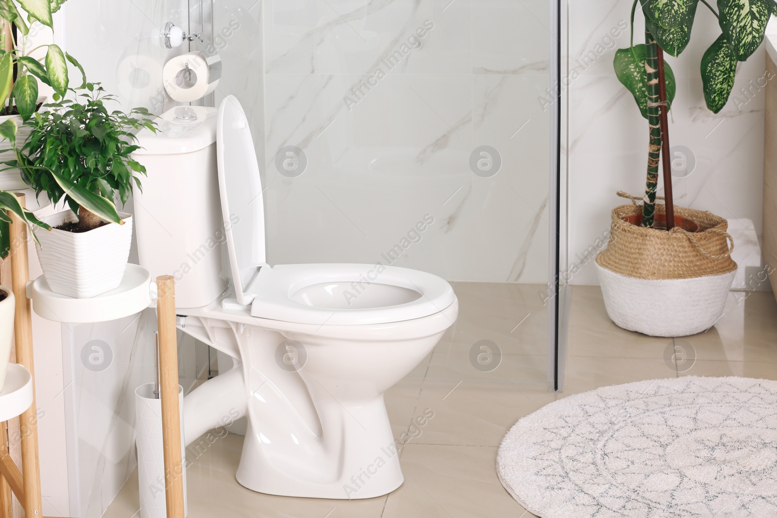 Photo of Stylish toilet bowl in modern bathroom interior