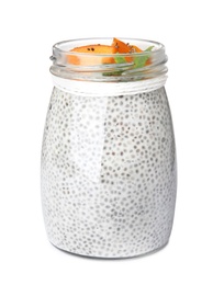 Photo of Glass jar of tasty chia seed pudding with persimmon isolated on white